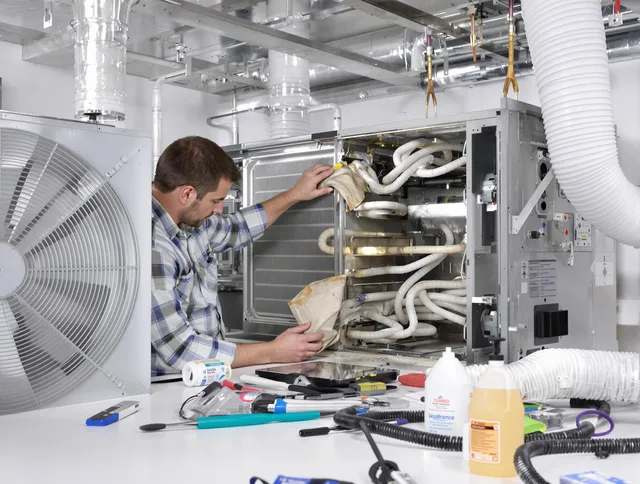 Weston Air Duct Cleaning specialist performing precision AC coil cleaning in Weston