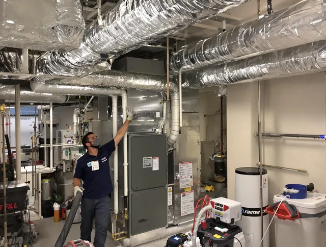Weston Air Duct Cleaning specialist performing thorough furnace duct cleaning in a Weston residence