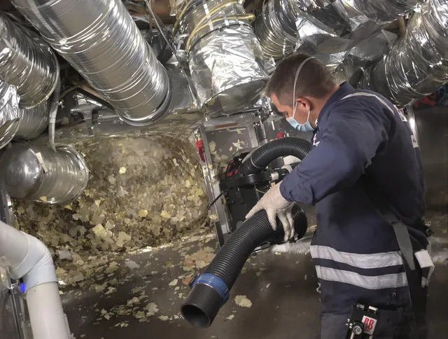 Weston Air Duct Cleaning specialist operating negative pressure cleaning equipment for thorough duct maintenance in Weston