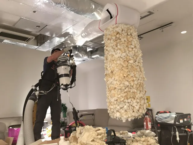 Weston Air Duct Cleaning technician performing precision vacuum insulation removal in a residential property in Weston