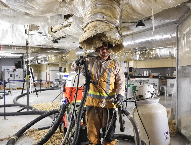 Professional vacuum insulation removal by Weston Air Duct Cleaning expert in Weston